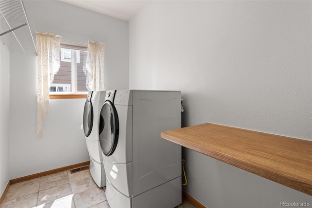 10284 Royal Eagle St, Highlands Ranch, CO 80129 - washroom with separate washer and dryer and baseboards