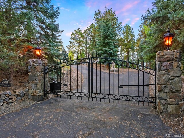 view of gate at dusk