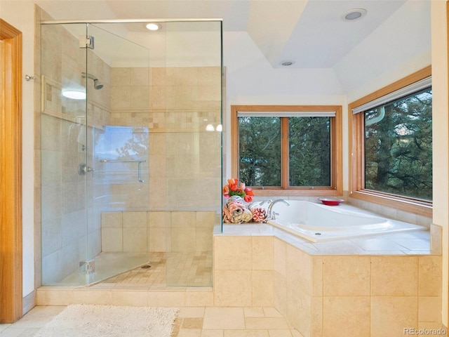 full bathroom featuring tile patterned flooring, a stall shower, a garden tub, and vaulted ceiling