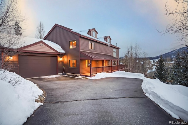 view of front of property with driveway and an attached garage