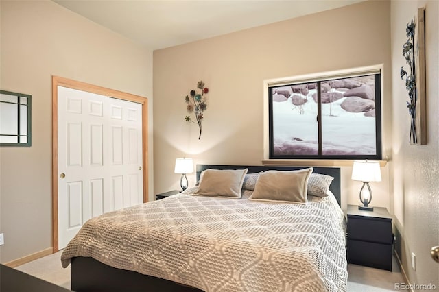 bedroom featuring baseboards and carpet