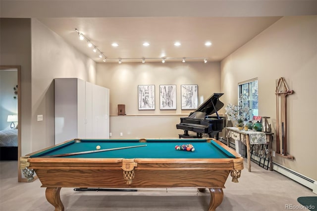 playroom with a baseboard heating unit, carpet, and rail lighting