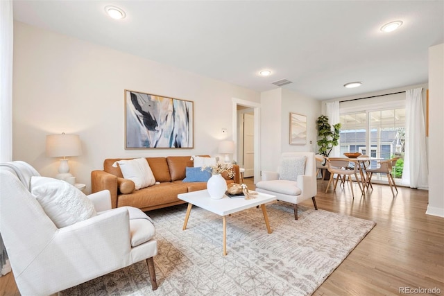 1805 W 51st Ave, Denver, CO 80221 - living room featuring visible vents, wood finished floors, baseboards, and recessed lighting