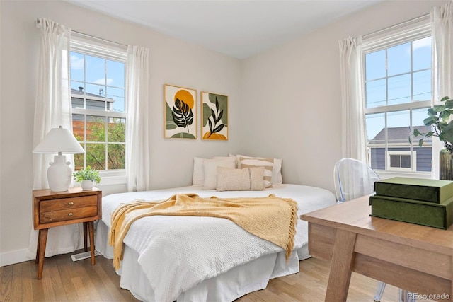 1805 W 51st Ave, Denver, CO 80221 - bedroom featuring baseboards and wood finished floors