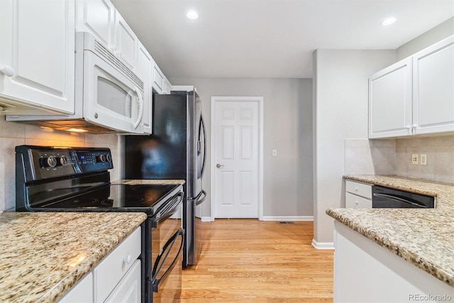 kitchen with light stone countertops, stainless steel dishwasher, black range with electric cooktop, light hardwood / wood-style flooring, and white cabinets