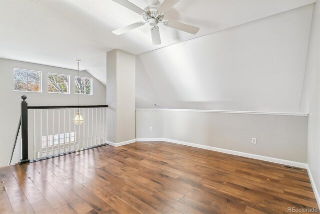 additional living space with ceiling fan, vaulted ceiling, and hardwood / wood-style flooring