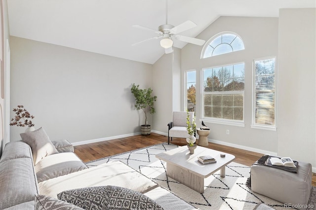 living room with light hardwood / wood-style floors, vaulted ceiling, and ceiling fan