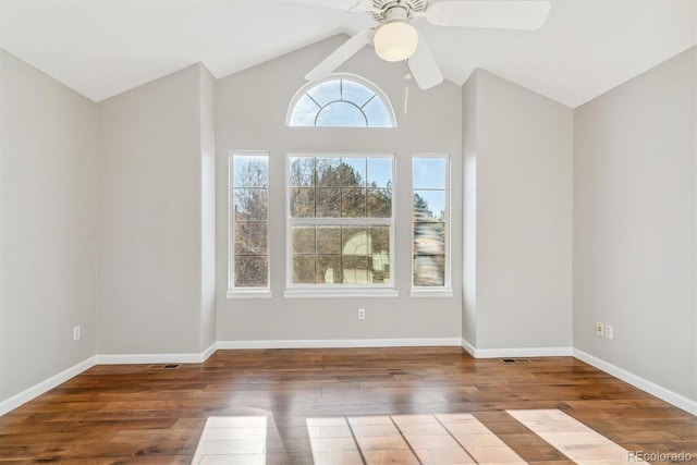 unfurnished room with hardwood / wood-style flooring, high vaulted ceiling, and ceiling fan