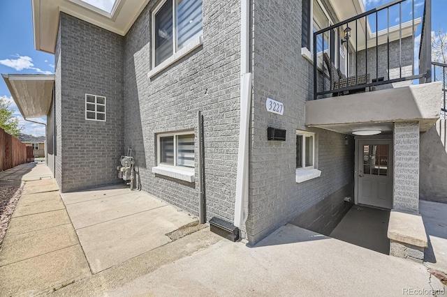 view of side of property with a balcony