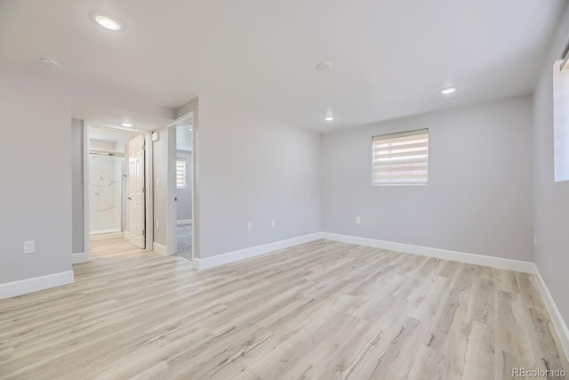 unfurnished room featuring light hardwood / wood-style floors