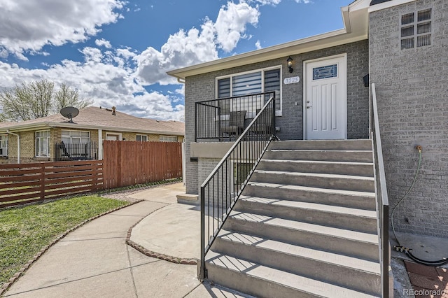 view of exterior entry featuring a patio