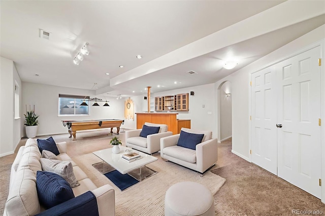 5284 Taft Ct, Arvada, CO 80002 - living room featuring light colored carpet, arched walkways, pool table, bar area, and recessed lighting