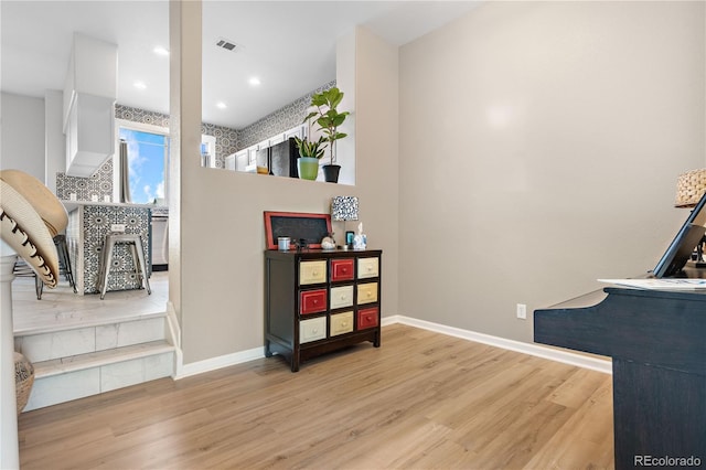 interior space with recessed lighting, visible vents, baseboards, and wood finished floors