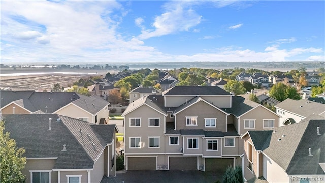 birds eye view of property with a residential view