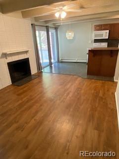 unfurnished living room featuring a baseboard heating unit, dark wood-type flooring, a fireplace, and beamed ceiling