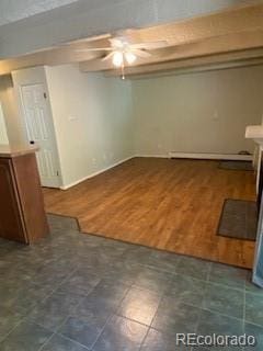 empty room with dark hardwood / wood-style floors and ceiling fan