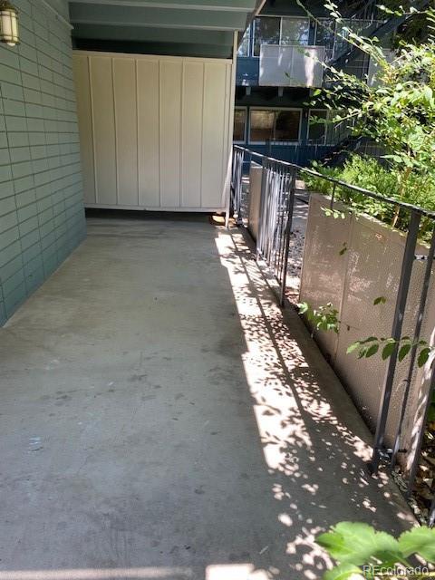 view of patio featuring a balcony