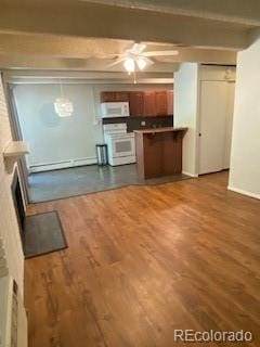 kitchen with range, baseboard heating, kitchen peninsula, beam ceiling, and hardwood / wood-style floors