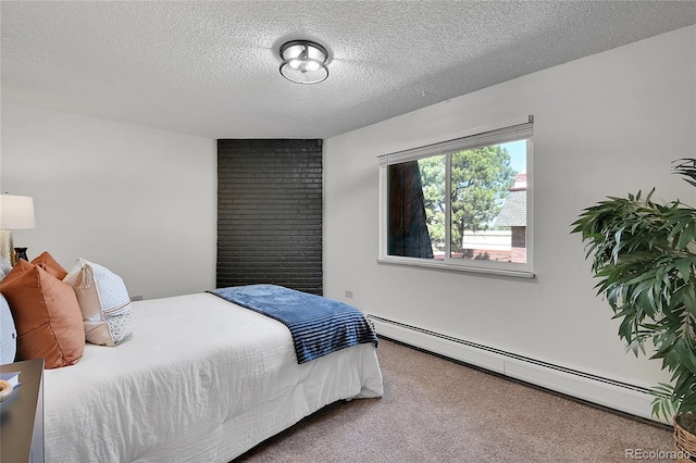 carpeted bedroom with a baseboard heating unit and a textured ceiling