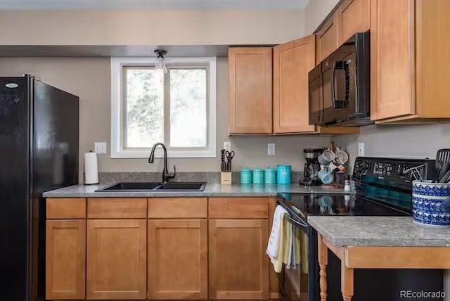 kitchen featuring black appliances and sink