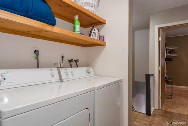 clothes washing area featuring independent washer and dryer