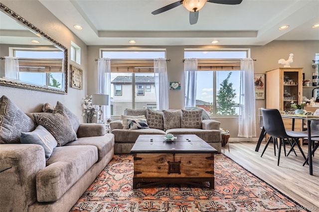 5153 Andes Way, Denver, CO 80249 - living area with light wood-type flooring, ceiling fan, recessed lighting, and a raised ceiling