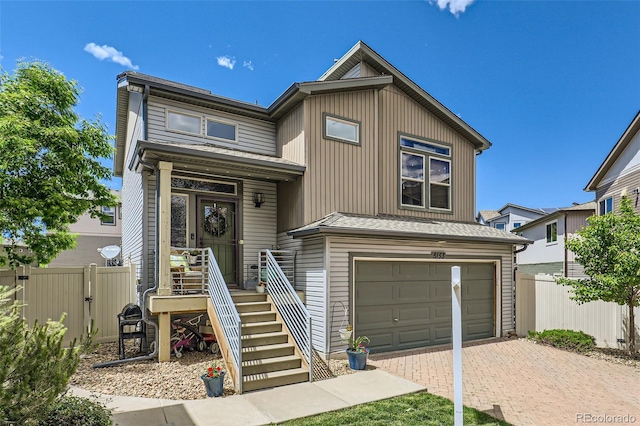 5153 Andes Way, Denver, CO 80249 - view of front of home featuring decorative driveway and a garage