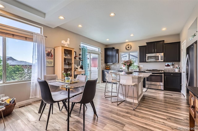 5153 Andes Way, Denver, CO 80249 - dining space featuring light wood-style flooring and recessed lighting