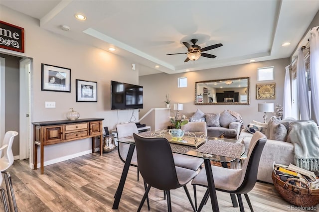 5153 Andes Way, Denver, CO 80249 - dining room featuring a raised ceiling, ceiling fan, light wood-type flooring, and recessed lighting