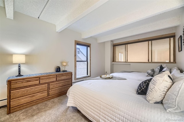 bedroom featuring a textured ceiling, carpet floors, and beamed ceiling