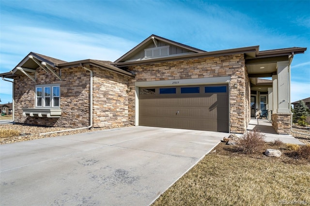 view of front of property with a garage and concrete driveway