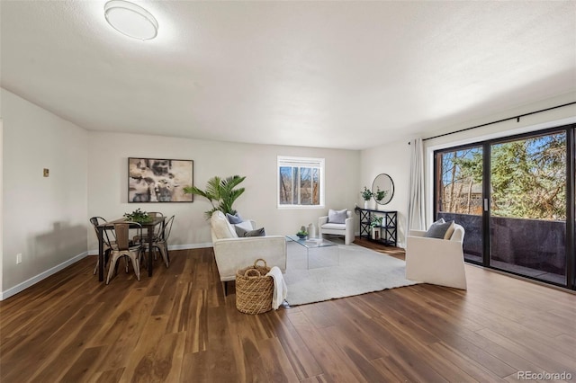 living room featuring baseboards and wood finished floors