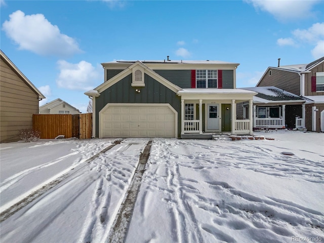 view of front of home featuring a porch and a garage