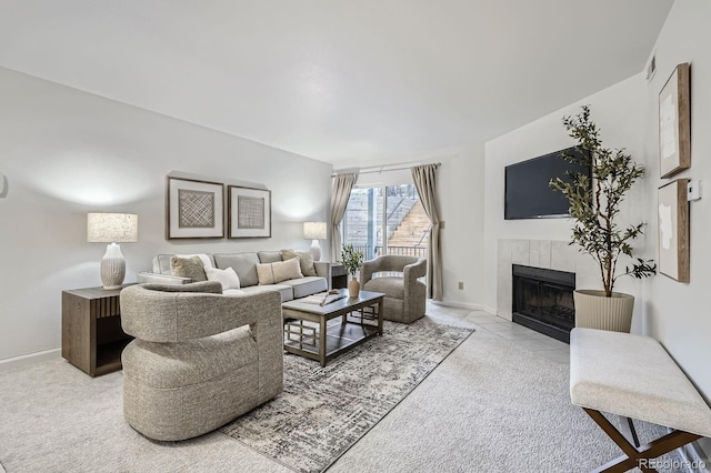 13093 W Cedar Dr Unit 121, Lakewood, CO 80228 - living area with a tiled fireplace and carpet flooring
