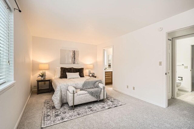 13093 W Cedar Dr Unit 121, Lakewood, CO 80228 - bedroom featuring light carpet and ensuite bath
