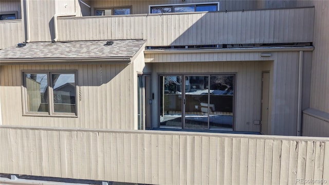 view of side of property featuring a balcony