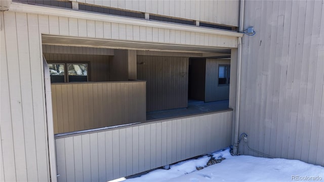 view of snow covered property entrance