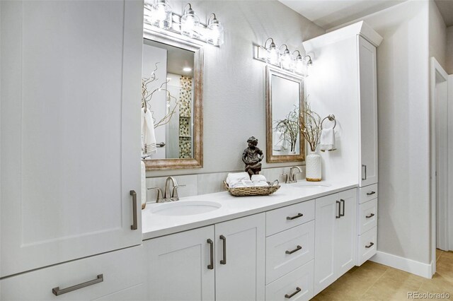 bathroom with tile patterned flooring and vanity