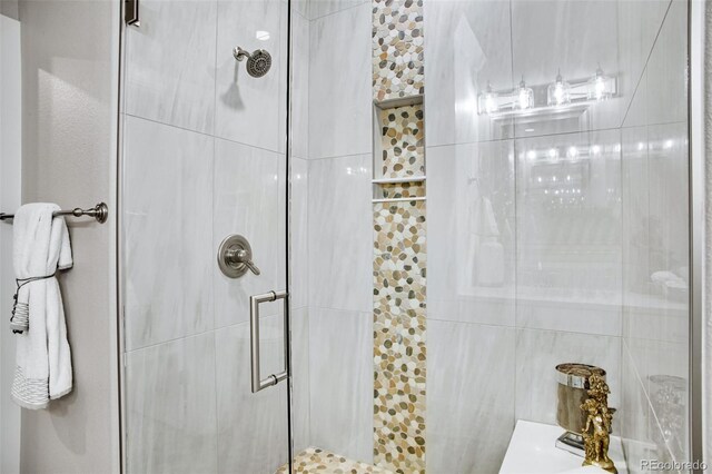 bathroom with tile walls and an enclosed shower