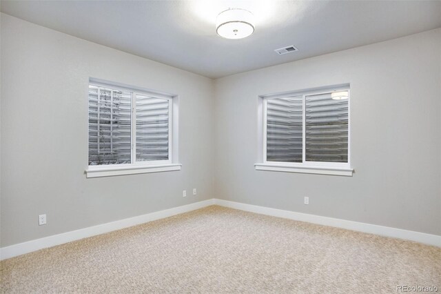 spare room featuring carpet flooring