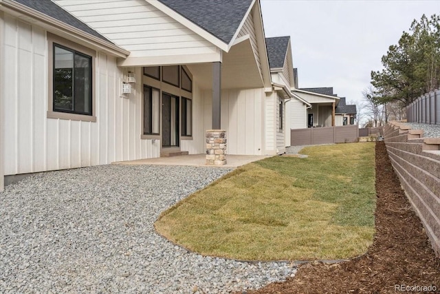 1361 Art Dr, Berthoud, CO 80513 - view of side of property featuring roof with shingles and board and batten siding