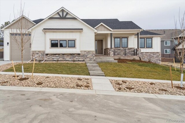 1361 Art Dr, Berthoud, CO 80513 - view of front of property featuring board and batten siding, stone siding, a porch, and driveway