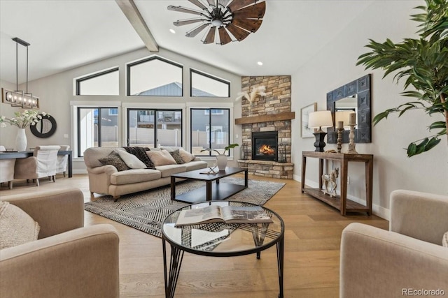 1361 Art Dr, Berthoud, CO 80513 - living area with wood finished floors, a fireplace, a chandelier, and baseboards