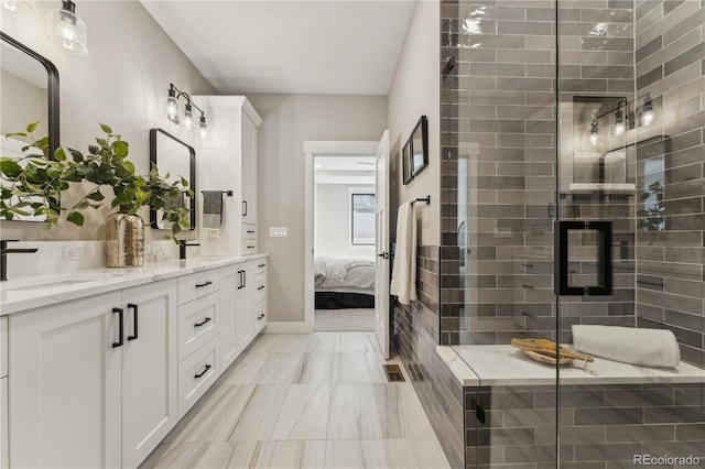 1361 Art Dr, Berthoud, CO 80513 - ensuite bathroom with double vanity, a stall shower, and marble finish floors