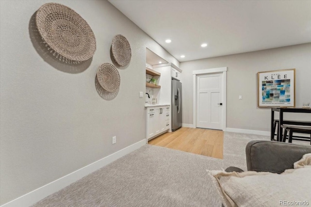 1361 Art Dr, Berthoud, CO 80513 - living room with light colored carpet, baseboards, and recessed lighting