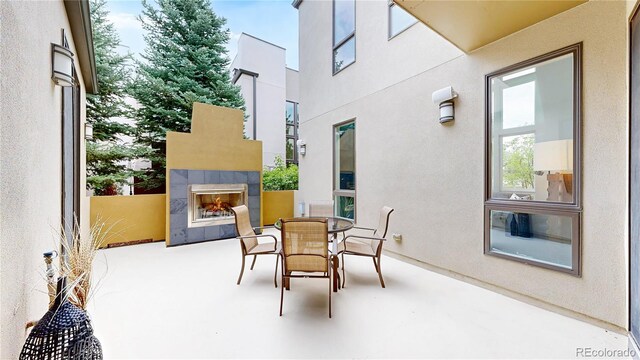 8041 E 29th Ave, Denver, CO 80238 - view of patio / terrace featuring a fireplace and outdoor dining area