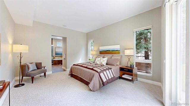 8041 E 29th Ave, Denver, CO 80238 - bedroom with light colored carpet and ensuite bath