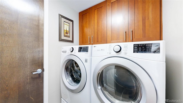 8041 E 29th Ave, Denver, CO 80238 - washroom with washing machine and clothes dryer and cabinet space