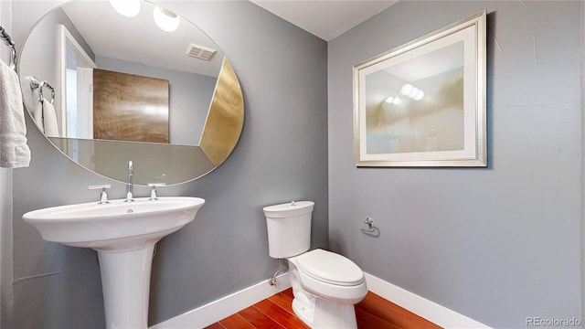 8041 E 29th Ave, Denver, CO 80238 - half bathroom with wood finished floors and baseboards