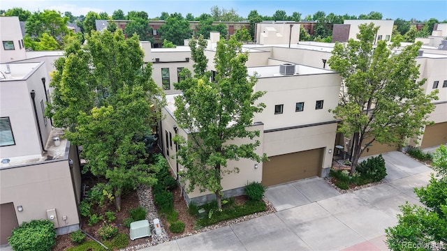 8041 E 29th Ave, Denver, CO 80238 - view of building exterior featuring a garage and driveway